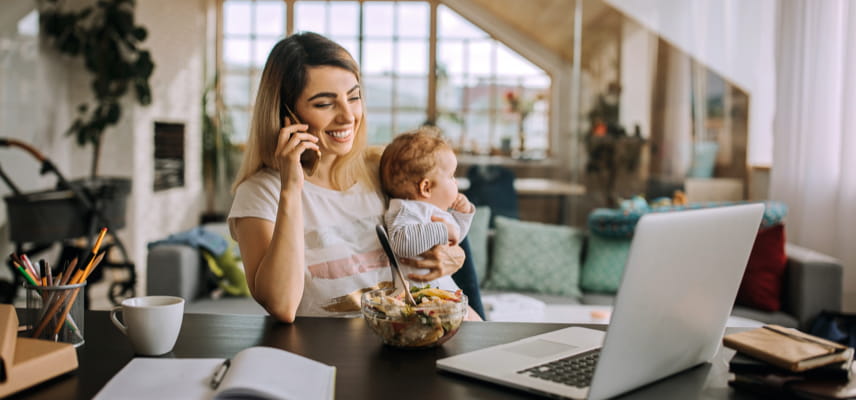 Mom on phone holding baby