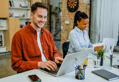 a man and a woman working in the office 