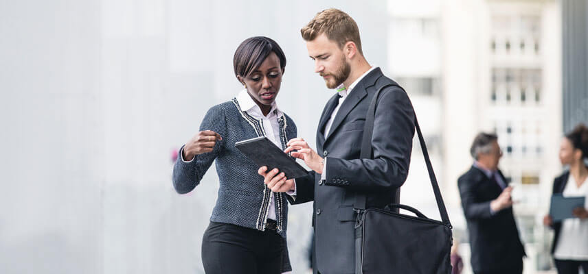 woman and man looking at tablet